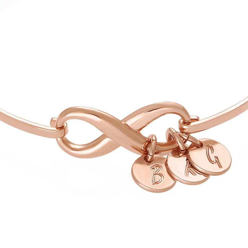 Infinity Bangle Bracelet with Initial Charms in Rose Gold Plating - 1